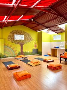 a room with a tree mural on the wall at Pisac Inca Guest House in Pisac +19 photos
