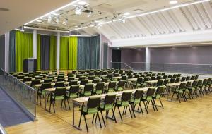 a large room with rows of tables and chairs at Thon Hotel Opera in Oslo