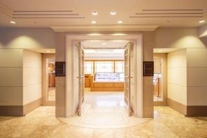TV a/nebo společenská místnost v ubytování Hotel New Grand