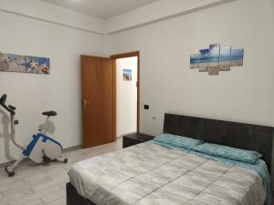 Posteľ alebo postele v izbe v ubytovaní Casa Trezza