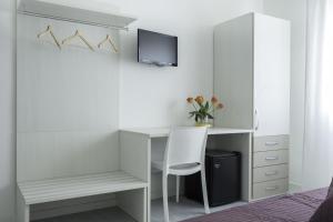 Televízia a/alebo spoločenská miestnosť v ubytovaní Easy Venice Rooms 1-2 + 11 fotografií