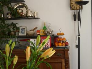 a room with a table with fruit on it at La Casa sui Tetti in Genoa