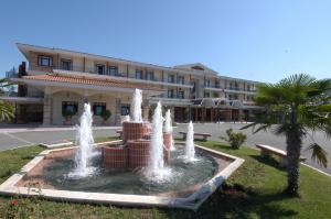 a water fountain in front of a building at Hotel Aiges Melathron in Veria