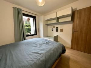 Ένα ή περισσότερα κρεβάτια σε δωμάτιο στο HeberGeneve : Domaine de Rochat