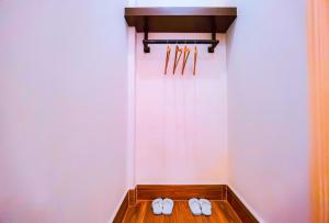 a pair of white slippers sitting in a room at Adventure Dome Resort in Kep