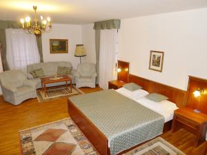 Postel nebo postele na pokoji v ubytování Hotel Nosal
