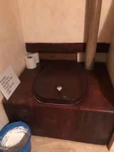 a toilet sitting on top of a wooden box at Subira House in Lamu