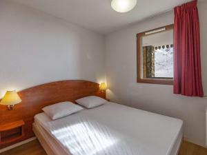 Posteľ alebo postele v izbe v ubytovaní Charmant T2 avec Piscine, Fitness et Terrasse, à 400m des Pistes - La Mongie - FR-1-404-341