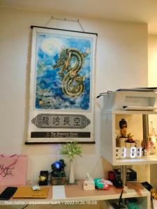 a painting of a snake hanging on a wall at Casa condo 5801/422 in Ban Na Song