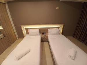 Postel nebo postele na pokoji v ubytování Lujain Hotel فندق النور واللجين