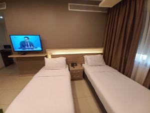 Postel nebo postele na pokoji v ubytování Lujain Hotel فندق النور واللجين