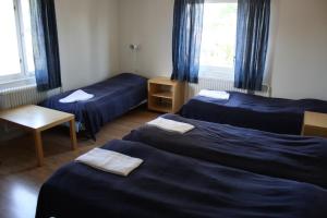 Un pat sau paturi într-o cameră la Gästhem Kronan