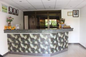 a lobby with a granite counter top at Sky Hotel International in Kampala