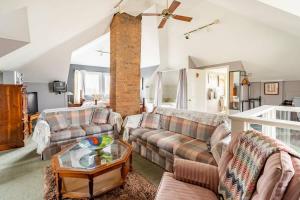 a living room with a couch and a table at Ye Olde Walkerville Bed & Breakfast in Windsor