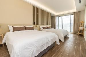 Postel nebo postele na pokoji v ubytování DOME Homestay