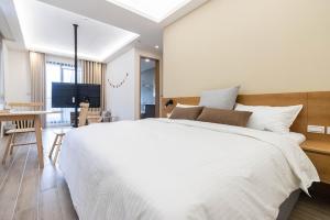 Postel nebo postele na pokoji v ubytování DOME Homestay
