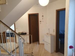 a room with a staircase and a room with a door at 5 Zimmer Appartement in ruhiger Lage nähe Heilbronn in Oedheim