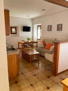 a living room with a couch and a table at TXARRENEA in Elizondo
