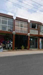 a large building with glass windows on a street at Air Vision 98 in Katunayaka