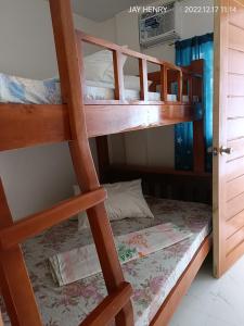 a bunk bed room with two bunk beds at Ocean View Room Jay Henry's Transient House in Pagudpud