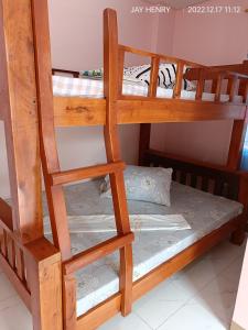 a pair of bunk beds in a room at Ocean View Room Jay Henry's Transient House in Pagudpud