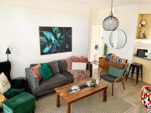 a living room with a couch and a table at Sunshine Four in Salisbury