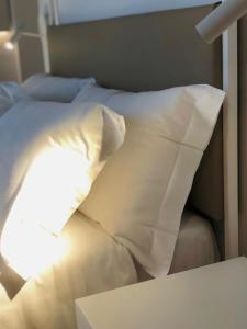 Postel nebo postele na pokoji v ubytování Hotel Saraceno Al Faro
