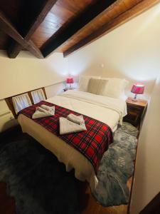 Säng eller sängar i ett rum på Parnassos Snow Hill Chalet