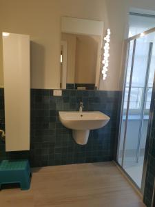 a bathroom with a sink and a mirror at Casa Rocca in Roccaforte Mondovì