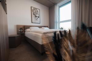Posteľ alebo postele v izbe v ubytovaní City Rooms Amstetten