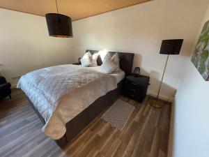 Ένα ή περισσότερα κρεβάτια σε δωμάτιο στο Unser Ferienhaus im Harz