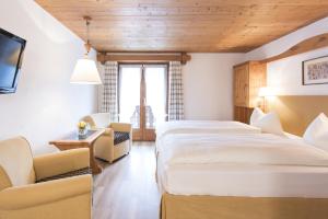 Postel nebo postele na pokoji v ubytování Hotel Steinbock