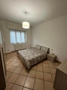Postel nebo postele na pokoji v ubytování Casa vacanze due laghi