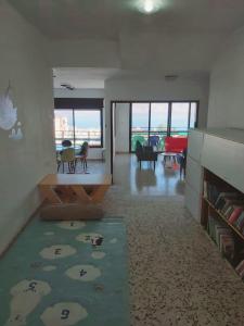 a living room with a view of a living room at turtle guesthouse- tiberias in Tiberias