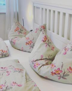 a group of pillows sitting on top of a crib at Apartments Oliver, Axams in Innsbruck