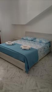 מיטה או מיטות בחדר ב-B&B A Casa di Anto
