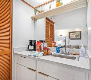 a kitchen with a sink and a counter top at @ Marbella Lane -Coastal retreat near Diamond Head in Honolulu
