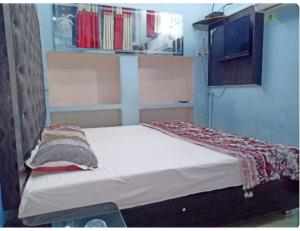 Giường trong phòng chung tại Hotel Good Will, Prayagraj
