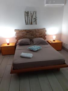 Postel nebo postele na pokoji v ubytování villa Philexiane