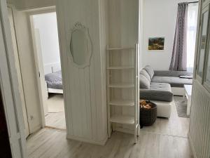 a living room with a door open to a living room at Lovely apartment with parking on closed premises. in Pärnu