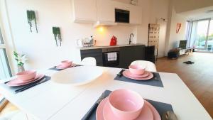 A kitchen or kitchenette at Rooftop Terrace, free garage parking and Pool!