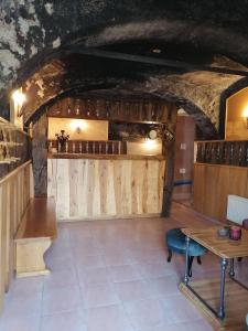 a tasting room in a cave with a table and benches at Wellness apartmaji Mimi in Tabor