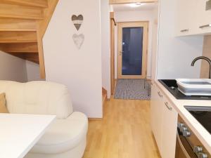 Kuchyň nebo kuchyňský kout v ubytování Appartement Fiffinjo