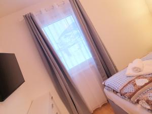 Postel nebo postele na pokoji v ubytování Appartement Fiffinjo