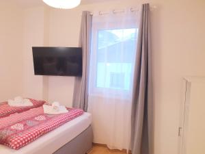 Postel nebo postele na pokoji v ubytování Appartement Fiffinjo