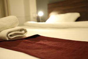 Säng eller sängar i ett rum på The Sydney Hotel