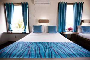 Letto o letti in una camera di Mango Inn Resort