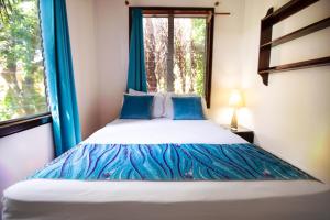 Letto o letti in una camera di Mango Inn Resort