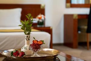 Ένα ή περισσότερα κρεβάτια σε δωμάτιο στο Olive Tree Hotel
