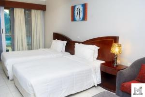 Postel nebo postele na pokoji v ubytování Mendiata Hotel